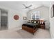 Cozy bedroom showcasing a ceiling fan, and a window with natural light at 3204 Cobblestone Ct, Raleigh, NC 27607