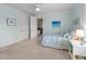 Bedroom with two closets, blue walls, and an ensuite bathroom at 3204 Cobblestone Ct, Raleigh, NC 27607