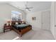 Bedroom with a ceiling fan, and an arched window with a view to the outdoors at 3204 Cobblestone Ct, Raleigh, NC 27607