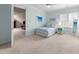 Light blue bedroom featuring a single bed, light carpet, and a bright window at 3204 Cobblestone Ct, Raleigh, NC 27607
