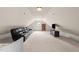 Finished bonus room with neutral paint, a large sofa, and ample natural light at 3204 Cobblestone Ct, Raleigh, NC 27607