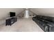 Spacious bonus room featuring a large couch, TV, and plenty of room to relax at 3204 Cobblestone Ct, Raleigh, NC 27607