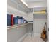 Walk-in closet with white shelving and rods at 3204 Cobblestone Ct, Raleigh, NC 27607