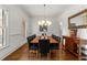Elegant dining room with hardwood floors, chandelier, and large table for gatherings at 3204 Cobblestone Ct, Raleigh, NC 27607