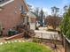 Elegant brick home featuring an attached garage, landscaped yard, and a charming curb appeal at 3204 Cobblestone Ct, Raleigh, NC 27607