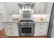 Well-equipped kitchen features stainless steel appliances and custom cabinets for an inviting cooking experience at 3204 Cobblestone Ct, Raleigh, NC 27607