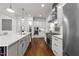 Gourmet kitchen with professional-grade stainless appliances, stone countertops, and custom cabinetry at 3204 Cobblestone Ct, Raleigh, NC 27607