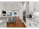 Open-concept kitchen featuring an island, stainless steel appliances, and a seamless flow to the living space at 3204 Cobblestone Ct, Raleigh, NC 27607