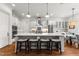 Spacious kitchen with stainless appliances, a large center island, and stylish barstool seating at 3204 Cobblestone Ct, Raleigh, NC 27607