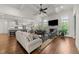 Open-concept living room features coffered ceilings, fireplace, and seamless flow to the kitchen at 3204 Cobblestone Ct, Raleigh, NC 27607