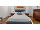 Comfortable main bedroom featuring hardwood floors and ample natural light at 3204 Cobblestone Ct, Raleigh, NC 27607