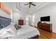 Airy main bedroom with hardwood floors, tray ceiling, and convenient ensuite access at 3204 Cobblestone Ct, Raleigh, NC 27607
