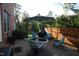Backyard patio features a fire pit, comfortable seating, and privacy fencing at 3204 Cobblestone Ct, Raleigh, NC 27607