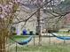 Landscaped backyard featuring a hammock and green open space at 3609 Kilgo Dr, Durham, NC 27705