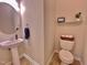 Well-lit powder room features a pedestal sink and modern fixtures at 3609 Kilgo Dr, Durham, NC 27705