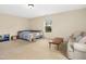 Large bonus room with ample space for lounging and relaxing, featuring a cozy couch and carpet at 3609 Kilgo Dr, Durham, NC 27705