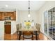 Elegant dining area with access to an outdoor deck and an indoor kitchen at 3609 Kilgo Dr, Durham, NC 27705