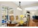 Open dining room with large glass door to outdoor living space and kitchen access at 3609 Kilgo Dr, Durham, NC 27705