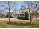 Charming two-story home with well-manicured landscaping, flowering trees and a two car garage at 3609 Kilgo Dr, Durham, NC 27705