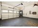 Well-organized garage with ample storage space, featuring a smooth floor and an automatic door at 3609 Kilgo Dr, Durham, NC 27705