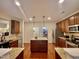 Open kitchen features stainless steel appliances, granite counters, and center island at 3609 Kilgo Dr, Durham, NC 27705