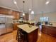 Eat-in kitchen features granite countertops, stainless steel appliances and an island at 3609 Kilgo Dr, Durham, NC 27705