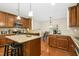 Spacious kitchen features granite counters, stainless steel appliances, and island seating at 3609 Kilgo Dr, Durham, NC 27705