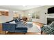 Comfortable living room with hardwood floors, a fireplace, and a stylish blue sofa at 3609 Kilgo Dr, Durham, NC 27705