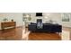 Bright living room boasts hardwood floors and a cozy fireplace at 3609 Kilgo Dr, Durham, NC 27705