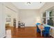 Bright and airy living room with hardwood floors and lots of natural light from two windows at 3609 Kilgo Dr, Durham, NC 27705