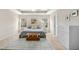 Spacious bedroom with neutral tones, two windows, and an accent chest at 3609 Kilgo Dr, Durham, NC 27705