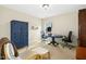 Well-lit office space with round table, chairs, and plenty of natural light from the window at 3609 Kilgo Dr, Durham, NC 27705