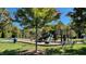 Community playground with swings, slides, climbing structures, and benches at 3609 Kilgo Dr, Durham, NC 27705