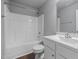 Bathroom featuring a shower-tub combo, white vanity, and modern fixtures at 38 Winter Red Way, Benson, NC 27504