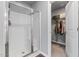 Bathroom including glass enclosed shower and view into walk-in closet at 38 Winter Red Way, Benson, NC 27504