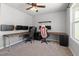 Bedroom with ceiling fan, carpet, and dual workspaces for studying or hobbies at 38 Winter Red Way, Benson, NC 27504