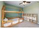 Bedroom with bed, storage shelves, carpet, and ceiling fan at 38 Winter Red Way, Benson, NC 27504