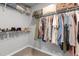 Walk-in closet featuring ample storage with clothing racks and shelves for organization at 38 Winter Red Way, Benson, NC 27504