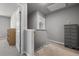 Upstairs hallway with neutral carpet and paint, and a dresser with metal hardware at 38 Winter Red Way, Benson, NC 27504
