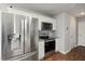White kitchen features stainless steel appliances, granite countertops, and tile backsplash at 38 Winter Red Way, Benson, NC 27504