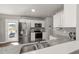 This kitchen features stainless steel appliances, granite countertops, and white cabinetry at 38 Winter Red Way, Benson, NC 27504