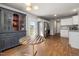 Open kitchen features stainless steel appliances, granite countertops and ample cabinet space with hardwood floor at 38 Winter Red Way, Benson, NC 27504