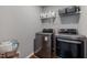 Laundry room with side-by-side washer and dryer, and a storage shelf at 38 Winter Red Way, Benson, NC 27504