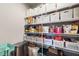 Organized pantry with wire shelving and an assortment of food items and storage containers at 38 Winter Red Way, Benson, NC 27504
