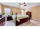 Comfortable bedroom with neutral walls, a queen-size bed, and natural lighting at 408 Knolls View Dr, Fuquay Varina, NC 27526