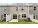 View of the backyard patios and rear exteriors of the townhomes at 42 Sweet Meadow Rd, Angier, NC 27501