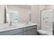 Bathroom with double sink vanity, a glass enclosed shower, and white cabinets at 42 Sweet Meadow Rd, Angier, NC 27501