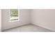 Bright bedroom features a window and neutral carpet at 42 Sweet Meadow Rd, Angier, NC 27501