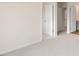 Neutral-toned bedroom showcases plush carpeting and a view of the open doorway at 42 Sweet Meadow Rd, Angier, NC 27501