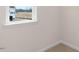 Well-lit bedroom corner with neutral carpet and large window with nice trim at 42 Sweet Meadow Rd, Angier, NC 27501